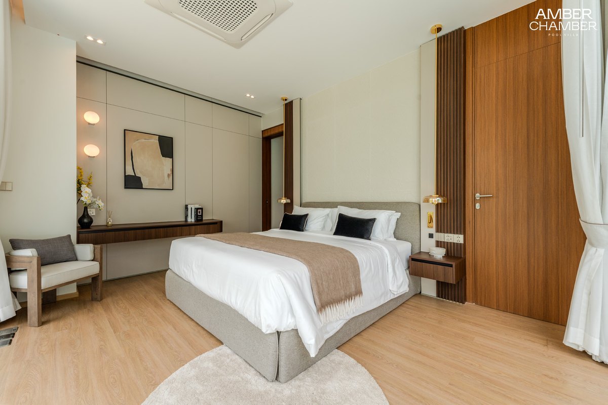 Amber Essence bedroom with timber panelling and soft linens
