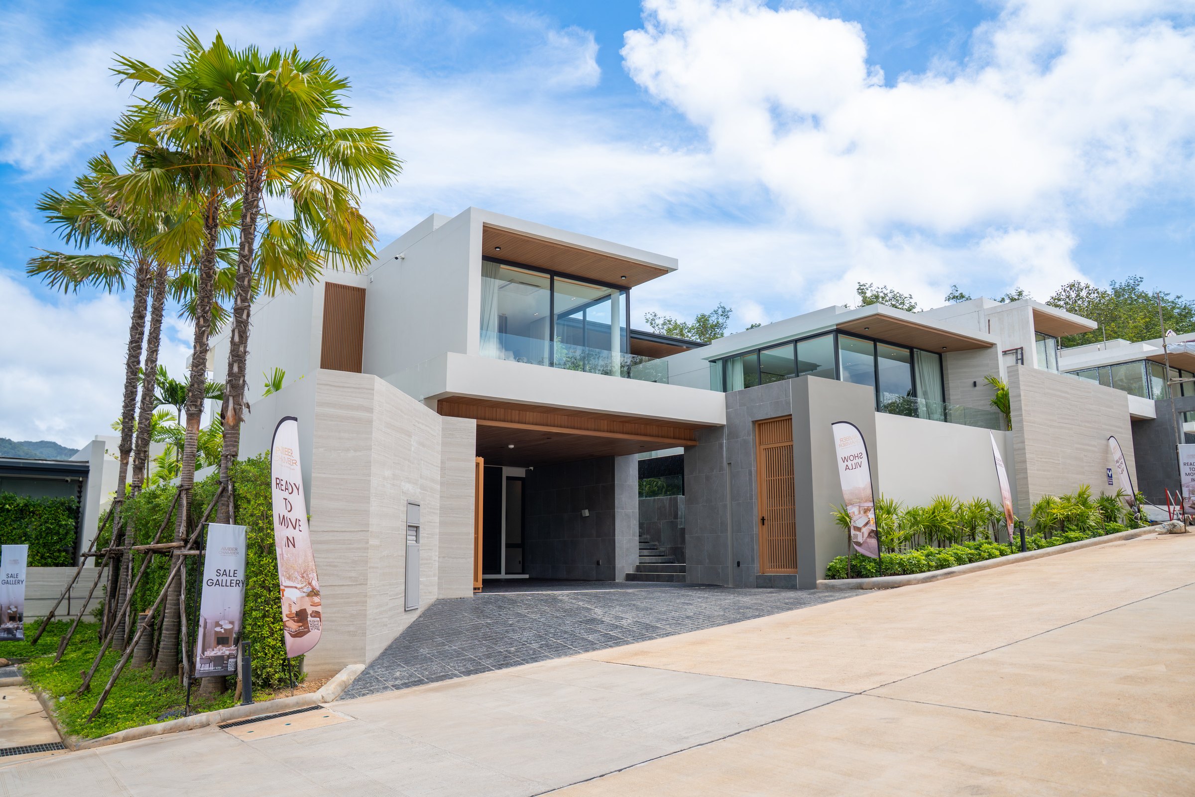 Amber Chamber pool villa street frontage with double-height glazing and covered entrance