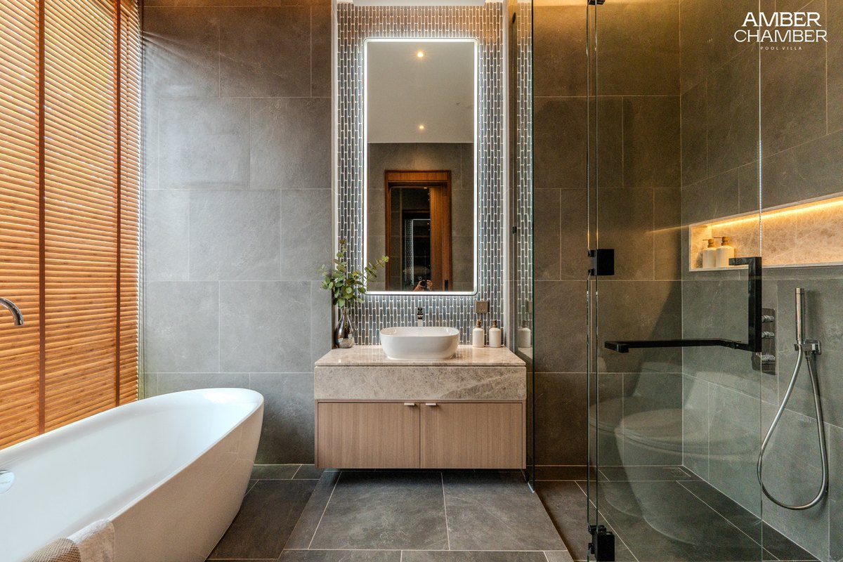 Amber Essence bathroom with freestanding tub and stone vanity
