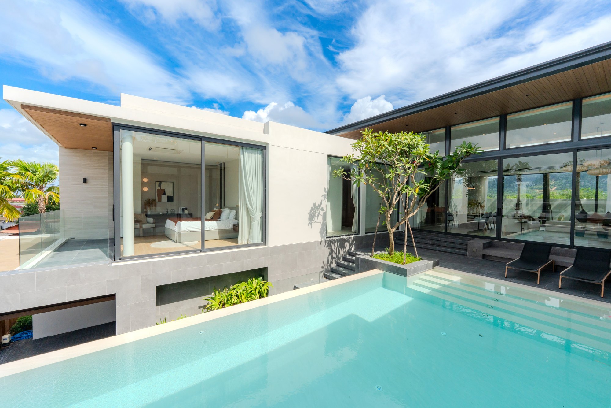 Amber Serenity villa with private swimming pool beside floor-to-ceiling glazing