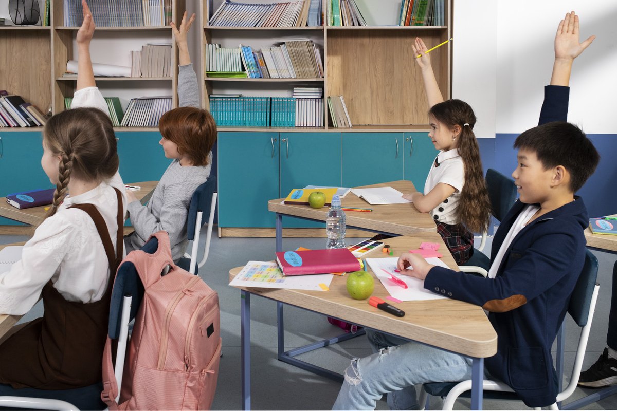 Children in a bright international school classroom near the project